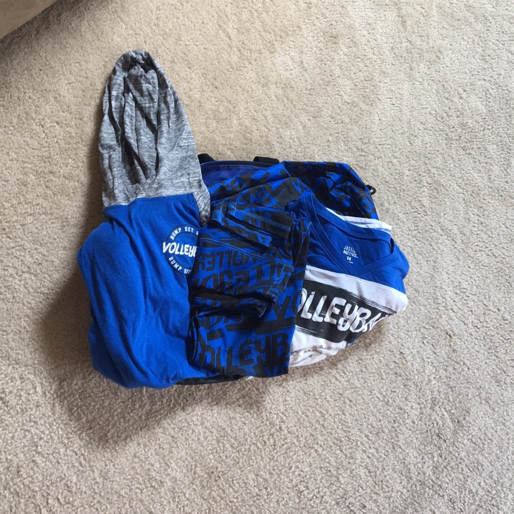 Four piece matching blue volleyball athletic set.